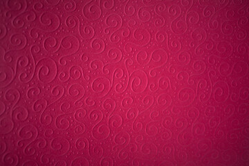 Textured decorative paper embossed Viva Magenta 2023. Space for copy. Color paper Viva Magenta for background, blur, soft focus.