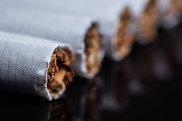 cigarette, cigarette on black background, pack of cigarettes, close-up of a cigarette