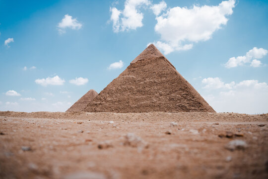 Ancient Egyptian pyramids in desert on sunny day