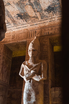 Statue of pharaoh in ancient rock cut temple
