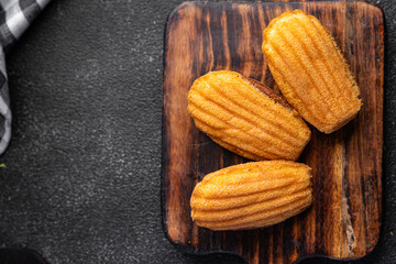Madeleine biscuit cookies sweet dessert delicious snack healthy meal food snack on the table copy space food background rustic top view