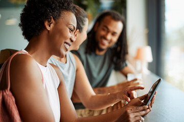 Sporty woman using her cellphone after the gym