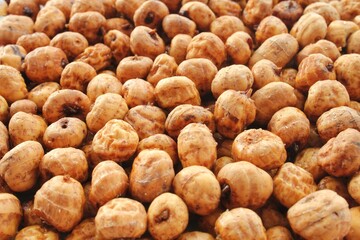 Close-up of chufa, tigernut, earth almond preparing for traditional typical tasty homemade cold fresh drink horchata from Valencia, Spain. Healthy organic food concept. Tiger nut for flour and milk