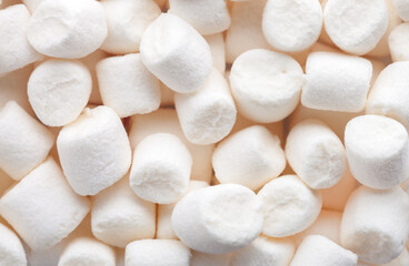 Fototapeta na wymiar Mini marshmallows of white color. Selective Focus. Flat lay.