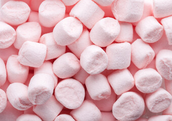 Mini marshmallows of  light pink color. Flat lay.  Selective Focus.