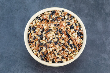 Black bowl with brown rice red rice and black rice ,Healthy diet concept