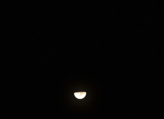 half moon on dark sky in night