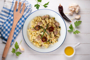 Italian risotto recipe with sausage and zucchini.