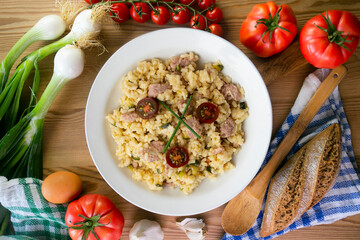 Italian risotto recipe with sausage and zucchini.