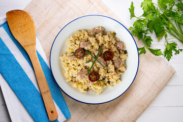Italian risotto recipe with sausage and zucchini.