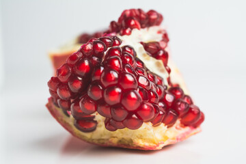 pomegranate fruit close isolated on white