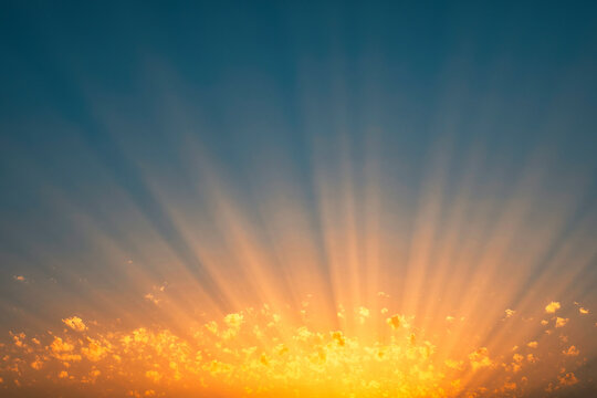 Rays of the sun through the clouds at sunset. breathtaking photo of the sky. Picturesque spectecular sunset.