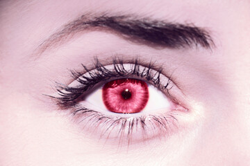 Red womans eye. Demonstrating Viva Magenta - trendy color of the year 2023 - 550914109