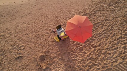 Freelancer working on the beach near the sea waves. Businessman on vacation in a tropical paradise. Remote work. 4G, 5G connection background - Powered by Adobe