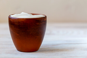 A bowl with fresh delicious sour cream