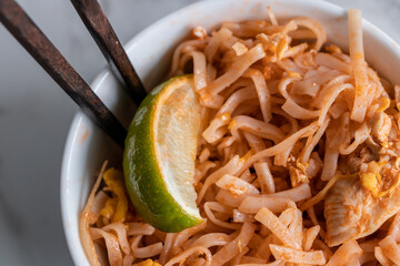 Close Up Pad Thai in White Bowl on White Background