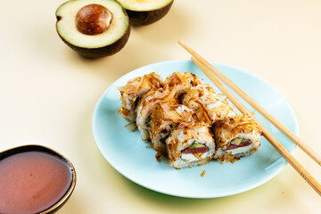 japanese sushi rolls with tuna chips, salmon and avocado