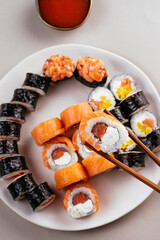 japanese sushi with salmon and props on the table