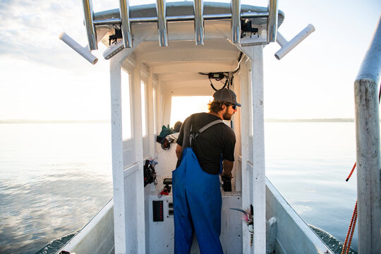 Oyster harvesting at sunrise on Narragansett Bay