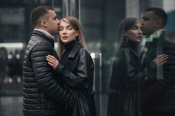A couple in love in the central metropolis of Ukraine. Love story on the background of skyscrapers