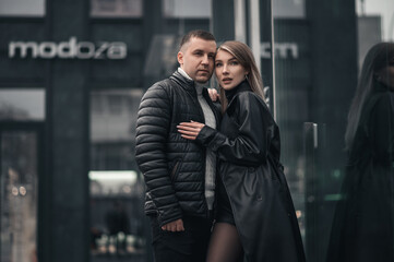 A couple in love in the central metropolis of Ukraine. Love story on the background of skyscrapers