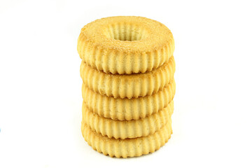 Simple ring shape tea cookies stacked and isolated on white background