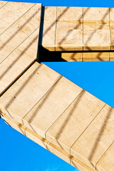 Shadows of lines on concrete of a bridge