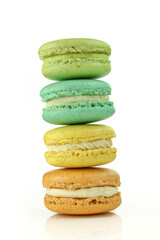Stacked colorful macarons isolated on white background.Tasty french macaroons 