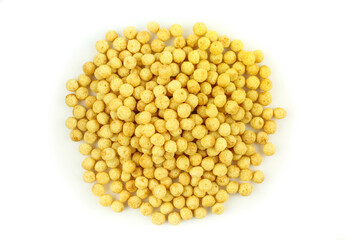 Pile of cereal balls isolated on white background. Healthy breakfast
