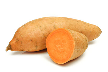 Whole and half sliced sweet potato batatas isolated on white background