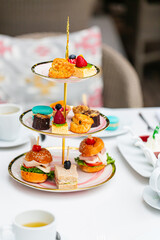 tea and sweets,Traditional english afternoon tea with selection of cakes and sandwiches