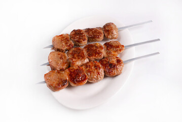 minced meat kebab on a white background