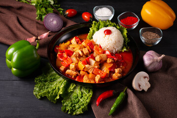 chicken meat with vegetables and rice