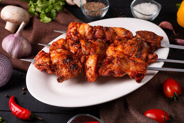 Chicken shish kebab, finely chopped, strung on a skewer
