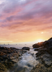 Fototapeta na wymiar Sea landscape with sunset sky and boats on the horizon