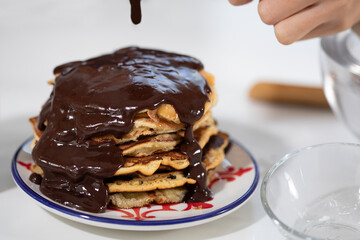 chocolate over pancake ready to eat