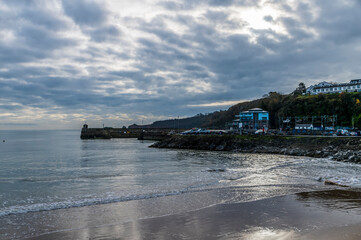A view from the beach towards the harbour in Saundersfoot, Wales in winter