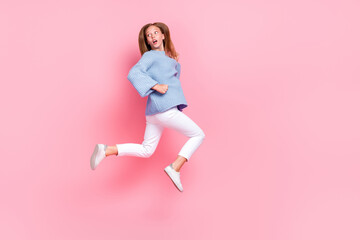 Fototapeta na wymiar Full body length photo of teen age schoolkid girl running looking empty space fast shocked cheap prices best offer isolated on pink color background