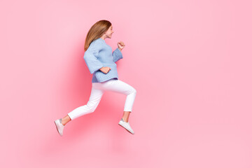 Fototapeta na wymiar Full length size photo of young running hurry schoolkid girl teenager wear blue knit jumper shopaholic season sale isolated on pink color background