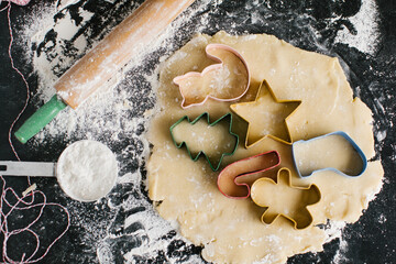 Fun and colorful cookie cutters arranged tightly on flat cookie dough