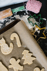 Freshly cut sugar cookies laying out on a cookie sheet ready to bake 