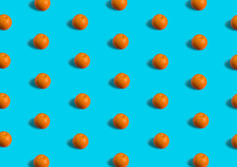Summer flat lay pattern made with fresh orange fruit on teal blue background. Minimal concept with soft shadows. - 550943915