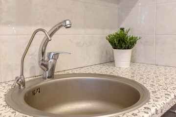 aluminum sink and faucet in the kitchen