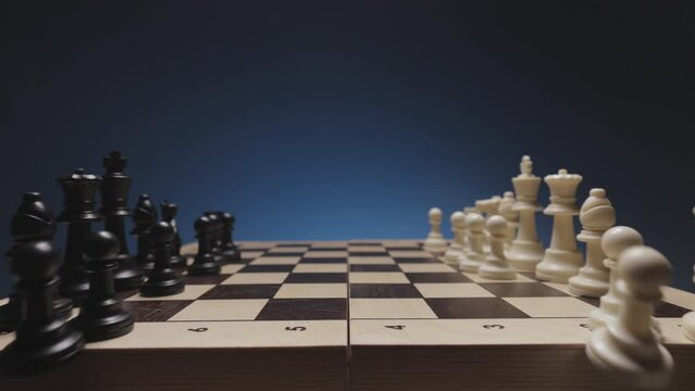 Chess in slowmo falls from the board to the camera. The camera is fixed on a chessboard.