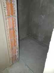 Building renovation. Brick walls. Plaster on the walls. Lining electrical cables