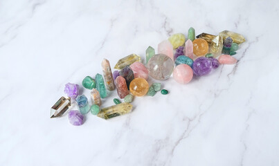 crystal gemstones close up on marble background. Minerals set for esoteric ritual, spiritual Magic practice, relaxation, meditation. Harmony, life balance concept. 