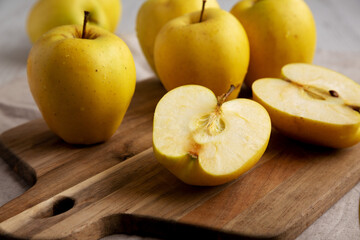 Naklejka na ściany i meble Raw Organic Golden Apples Ready to Eat, side view. Close-up.