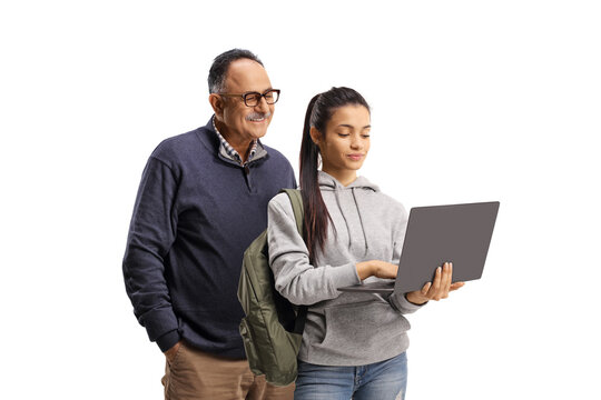 Mature man and a female student standing and using a laptop  computer