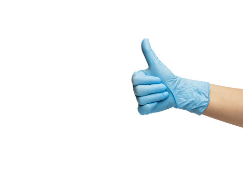 The hand in the glove of the nitrile shows the gesture of the thumb up. isolated on a white background. High quality photo