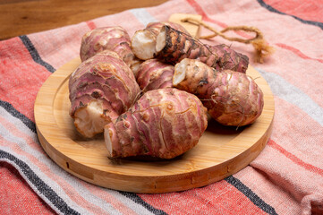 Group of fresh uncooked topinambur or Jerusalem artichoke roots